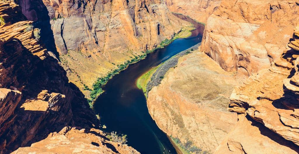 dark blue colorado river carving through horseshoe bend