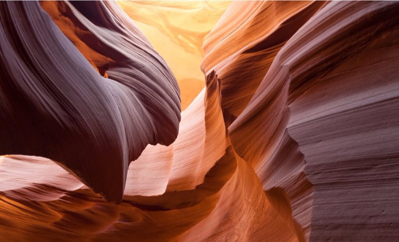 curvy orange and yellow rocks in antelope canyon