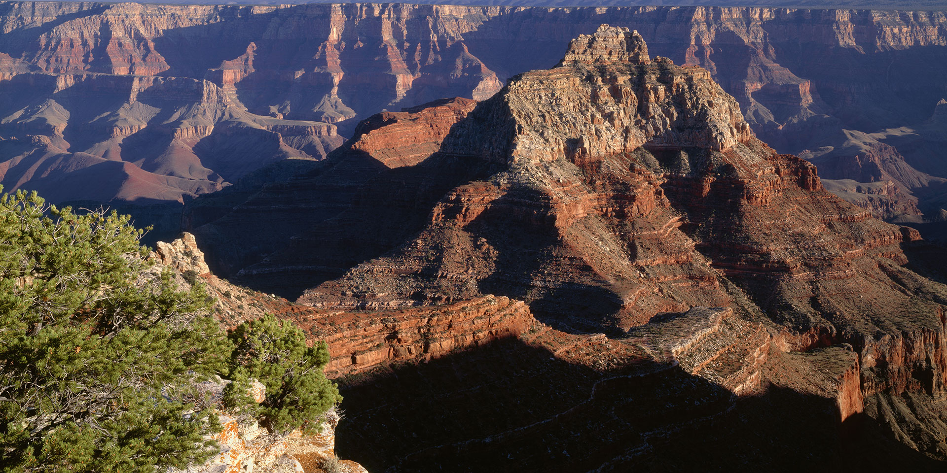 looking down at a layered rock formation in the grand canyon