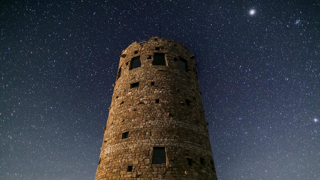 desert view watchtower in front of a starry sky