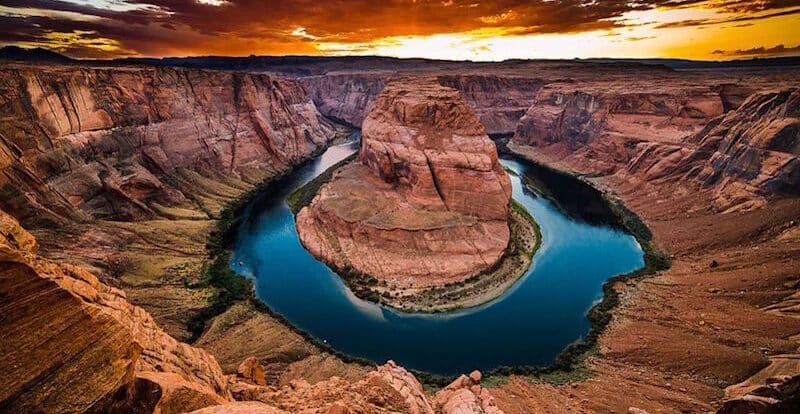 horseshoe bend with glowing sky