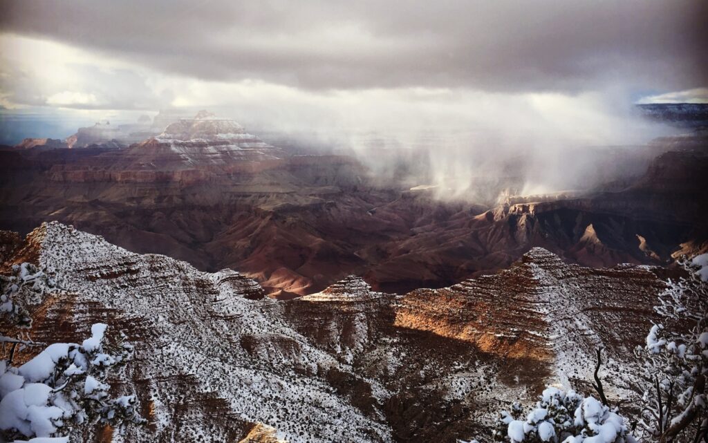 a snowstorm dusting the rocks of the grand canyon