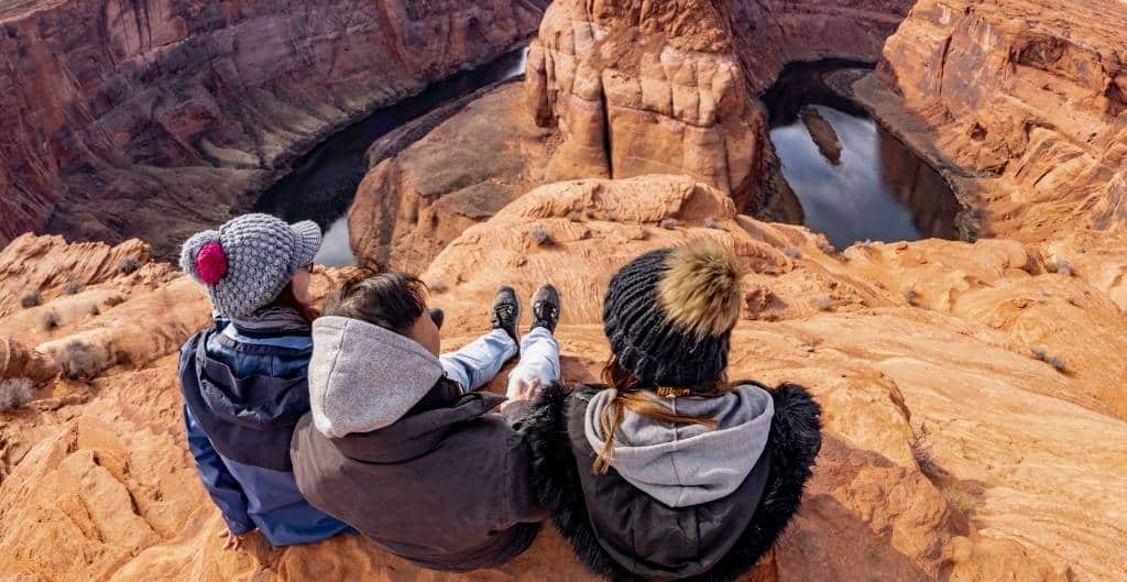group of 3 overlooking horseshoe bend
