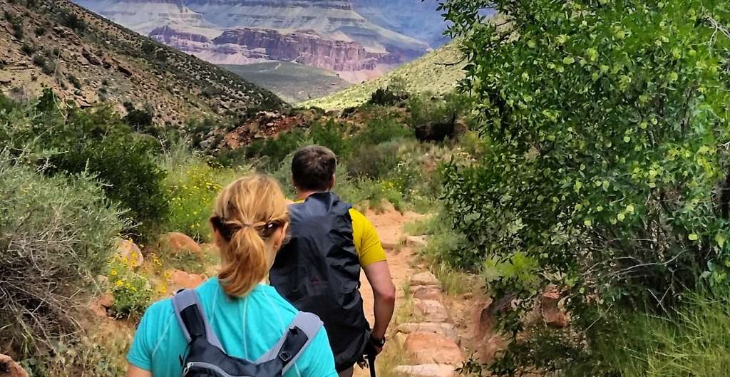 two people hiking in the grand canyon