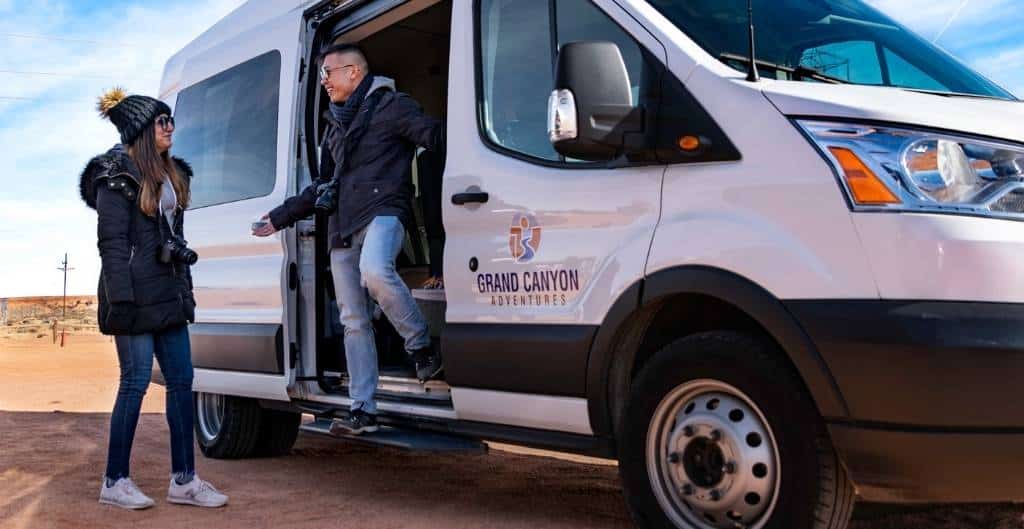 people exiting grand canyon adventures van