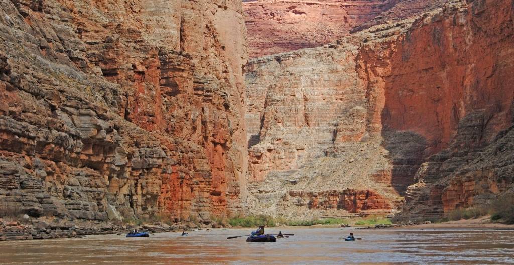 group of rafts on the colorado river in the grand canyon