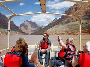 group of people on a boat on the colorado river