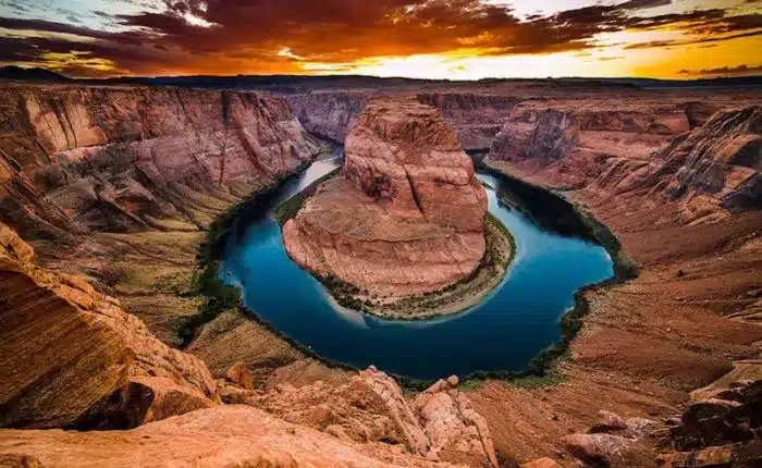 horseshoe bend with glowing sky