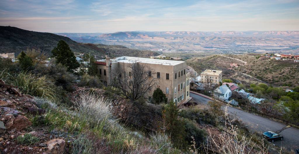 view of the mining town of jerome, az, looking down into the valley below