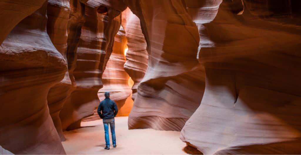 person walking in antelope canyon