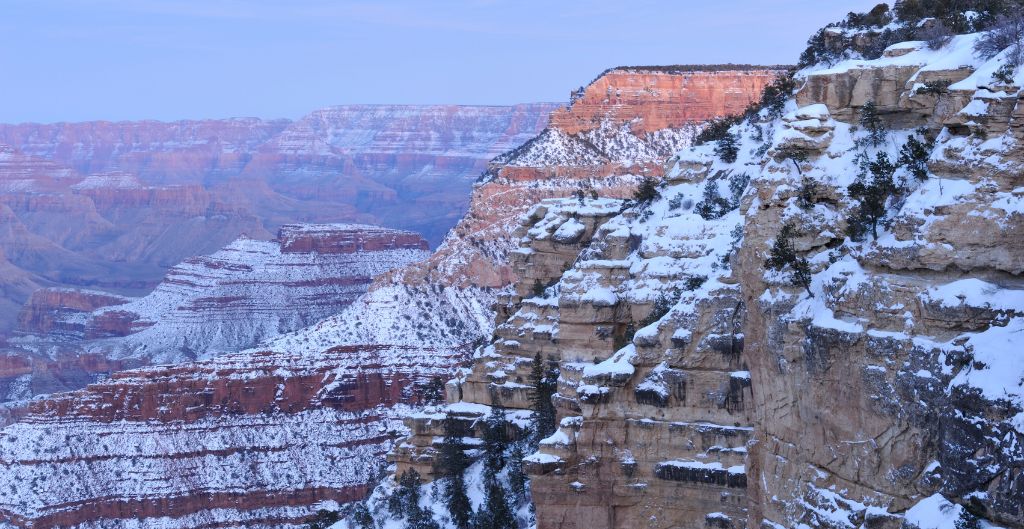 snow covering the cliff sides at the grand canyon