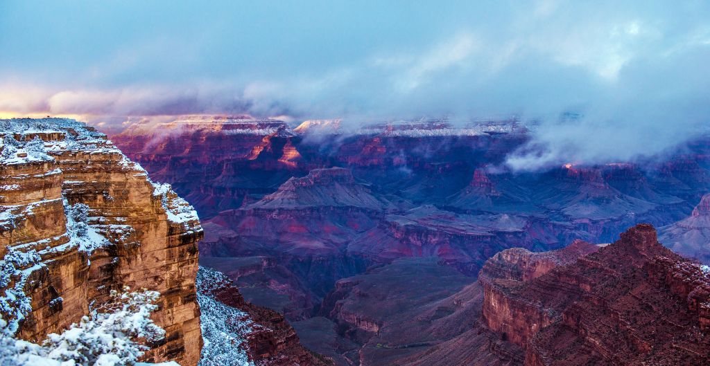 snow dusting the grand canyon and a purple glow