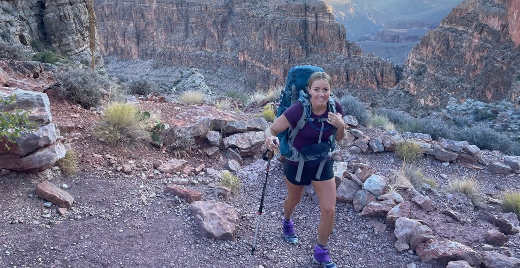 A woman hiking on a trail in Grand Canyon National Park
